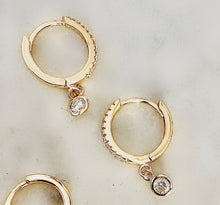 Load image into Gallery viewer, Charmed CZ Bezel Sterling Silver Huggie Earrings