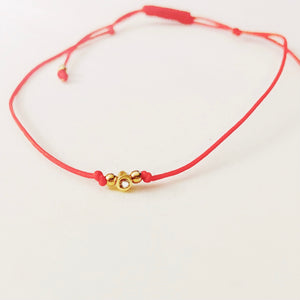 Red Pull Cord Touch of Gold String Bracelet